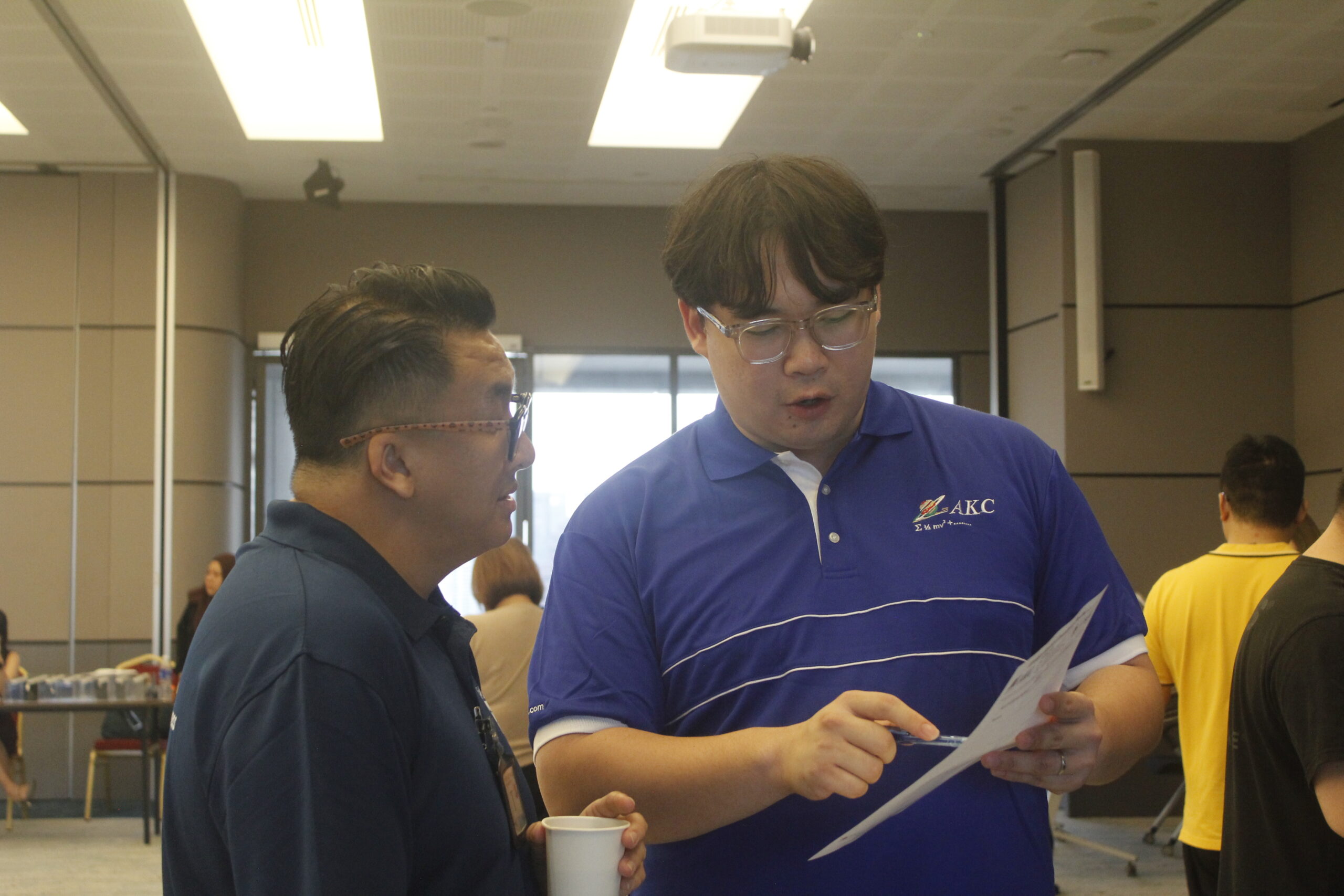 AKC consultant going through a form with a visitor at the roadshow