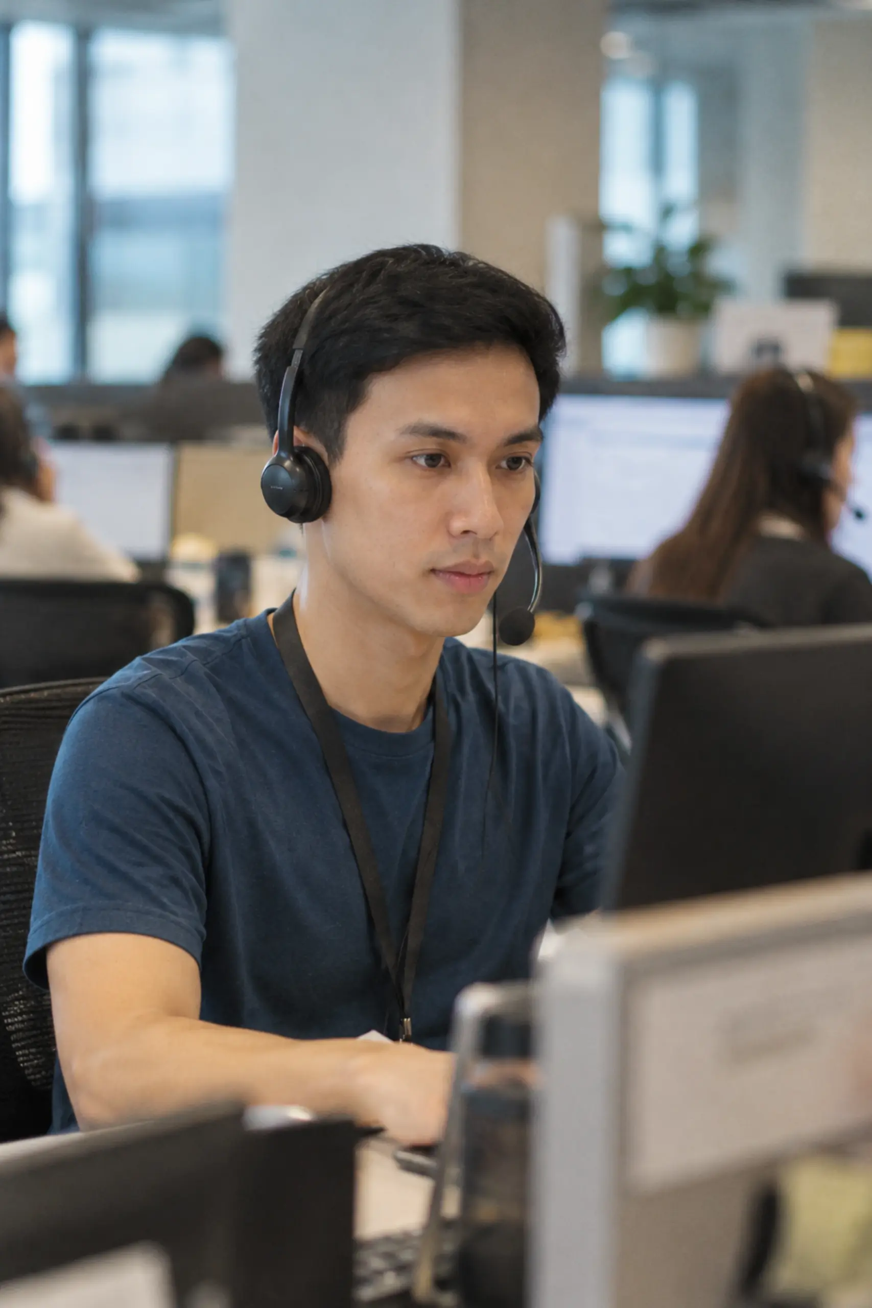 Office staff learning to identify cybersecurity scams and phishing threats
